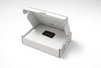Black Phreno head-impact sensor in its open white product box